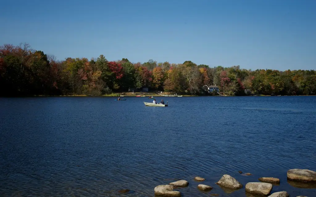 A canoe on a lake in Algonquin Park in autumn