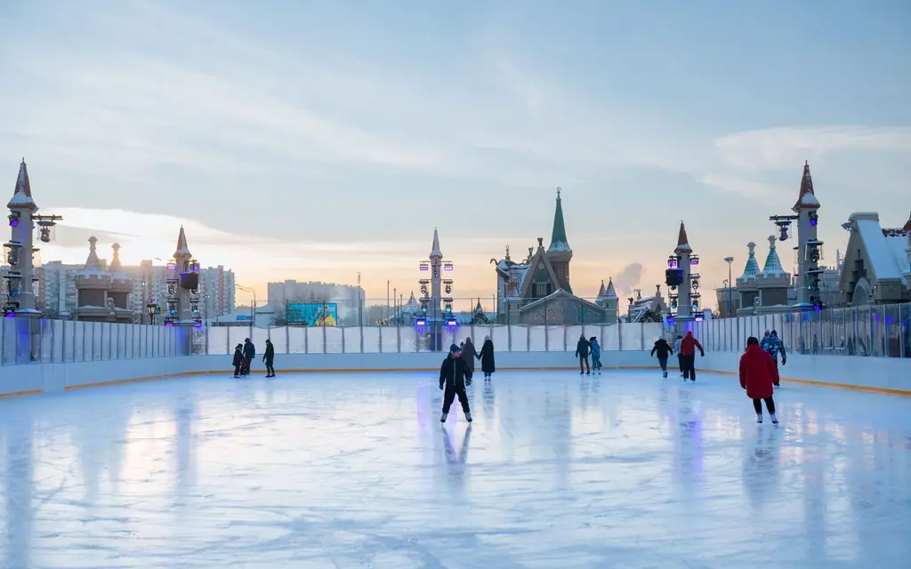 A family skating on an outdoor rink