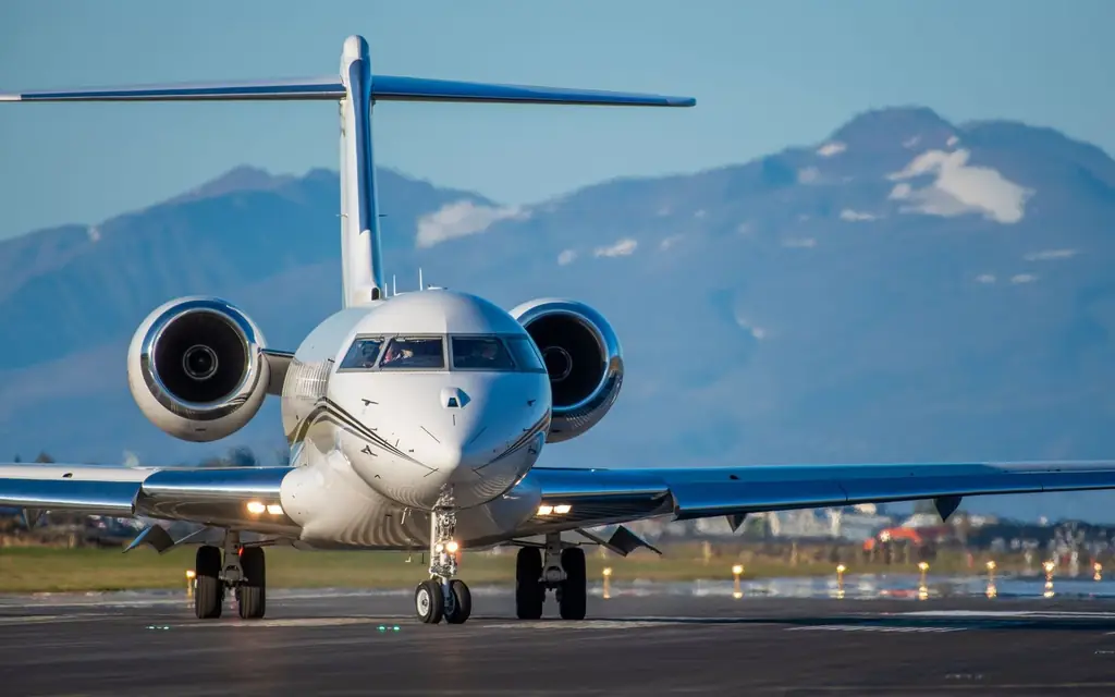 A private jet against the mountains