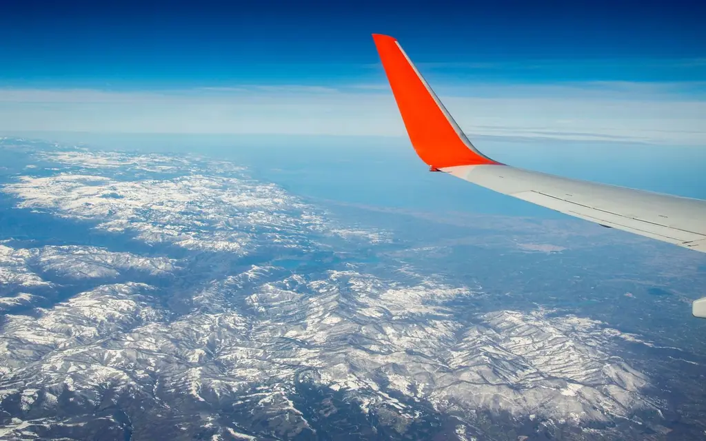 A private jet against the mountains