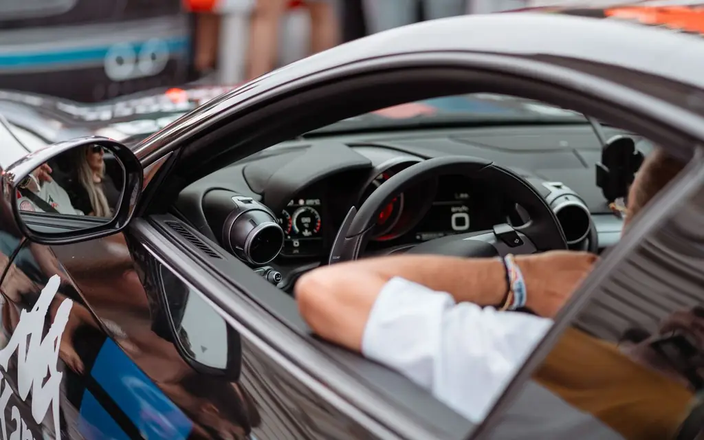 A driver's hands on the steering wheel