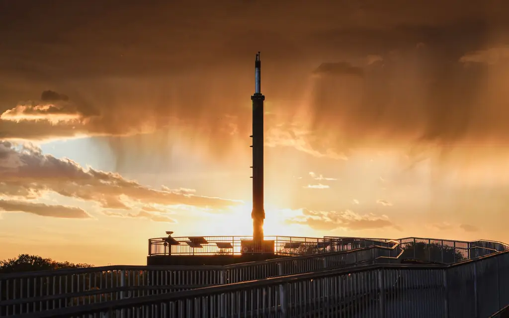 A tower silhouetted against a Winnipeg sunset