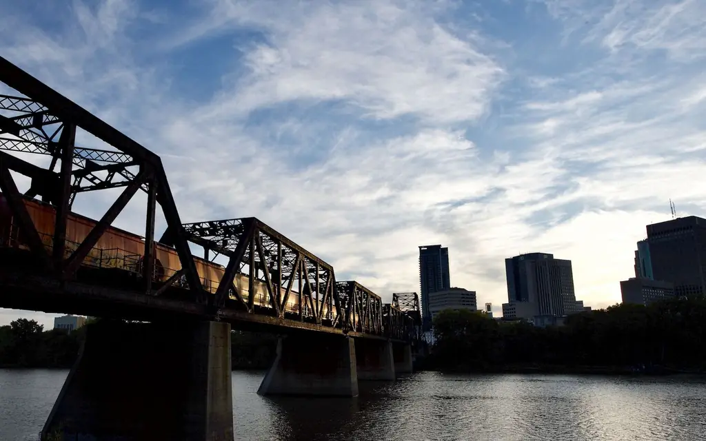 A railway bridge below the downtown skyline