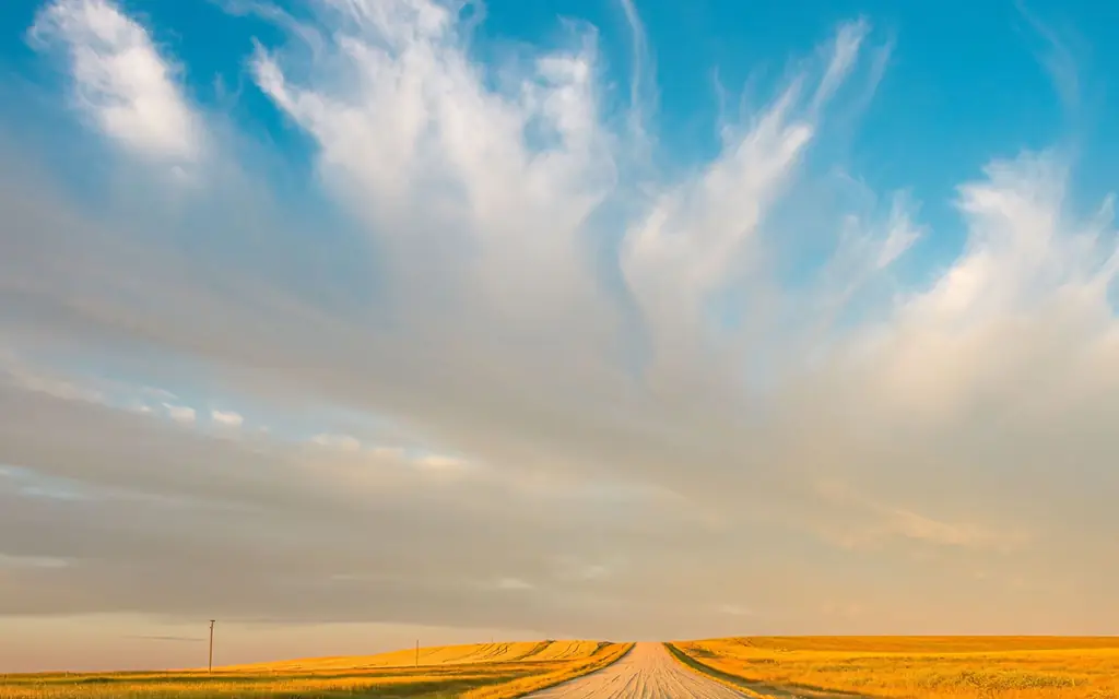 Prairie road under a wide Saskatchewan sky