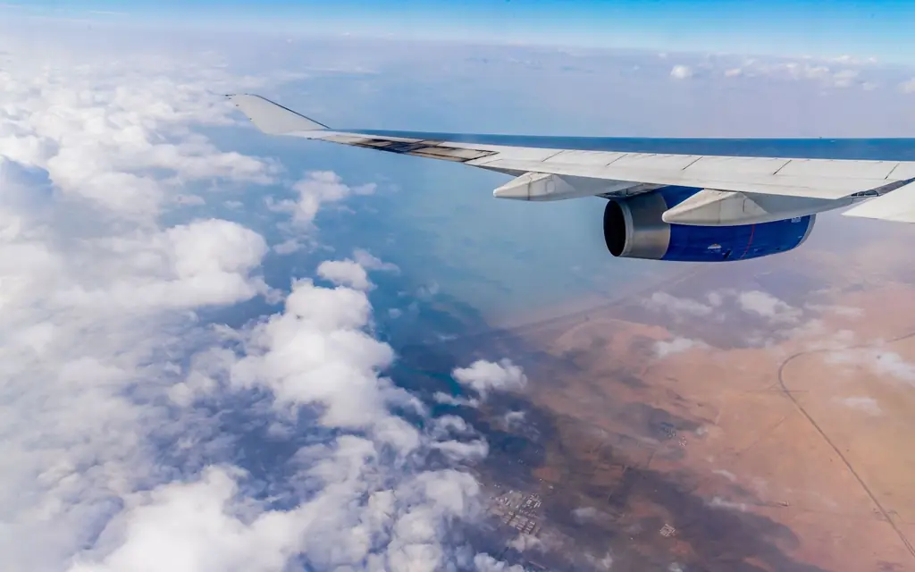 Aircraft wing over the clouds